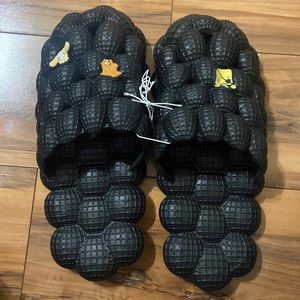 Black bubble slides with crocs charms